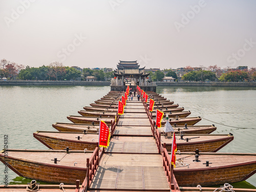 Chaozhou/China-02 April 2018:Unacquainted people on Guangji Bridge at Chaozhou City China.also known as Xiangzi Bridge,is an ancient bridge that crosses the Han River east of Chaozhou