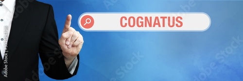 Cognatus. Lawyer in suit points with his finger to a search box of a Browser. The word is in focus. Blue Background. Law, justice, jurisprudence photo
