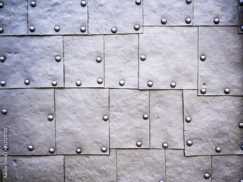 Metal plates assembled with rivets