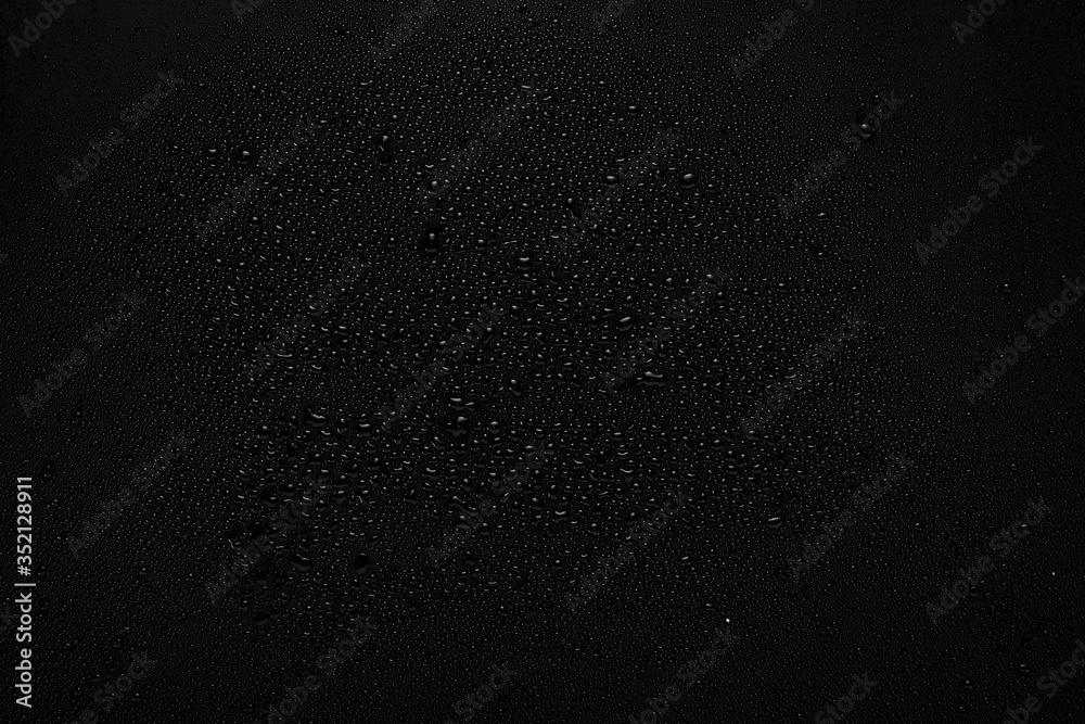 water drops on black background water drops on black background