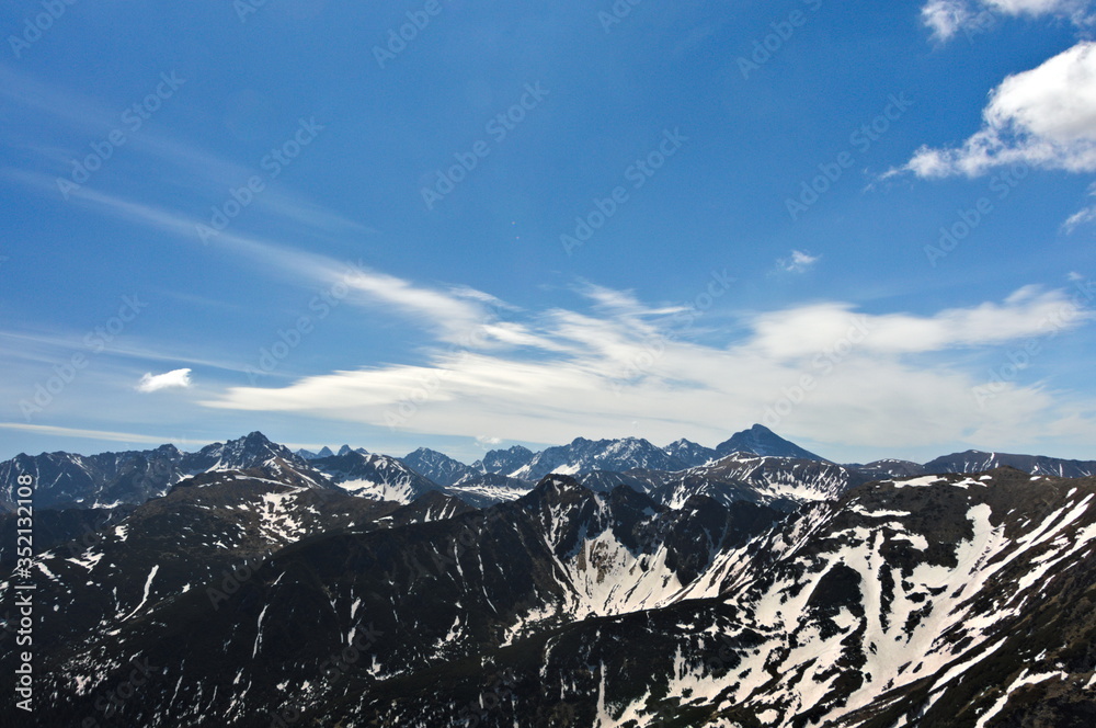 snow covered mountains in spring

