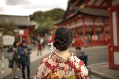 Woman in kimono strolling in the street of Kyoto