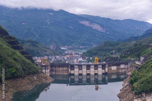 Dam wall and surrounding landscape at Wulong Dam in Chongqing, China. © phanthit malisuwan