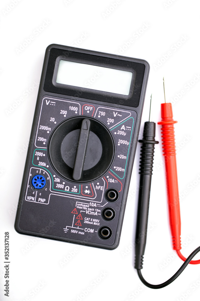 Digital multimeter and probes on white background Digital multimeter and probes on white background