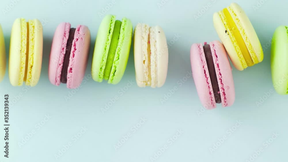 Macaroons or macaron on pastel blue surface. Close up. Macaroons or macaron on pastel blue surface. Close up.