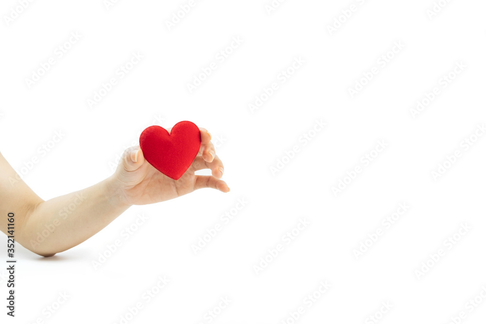 Fototapeta premium Hand holding red heart isolated on white background