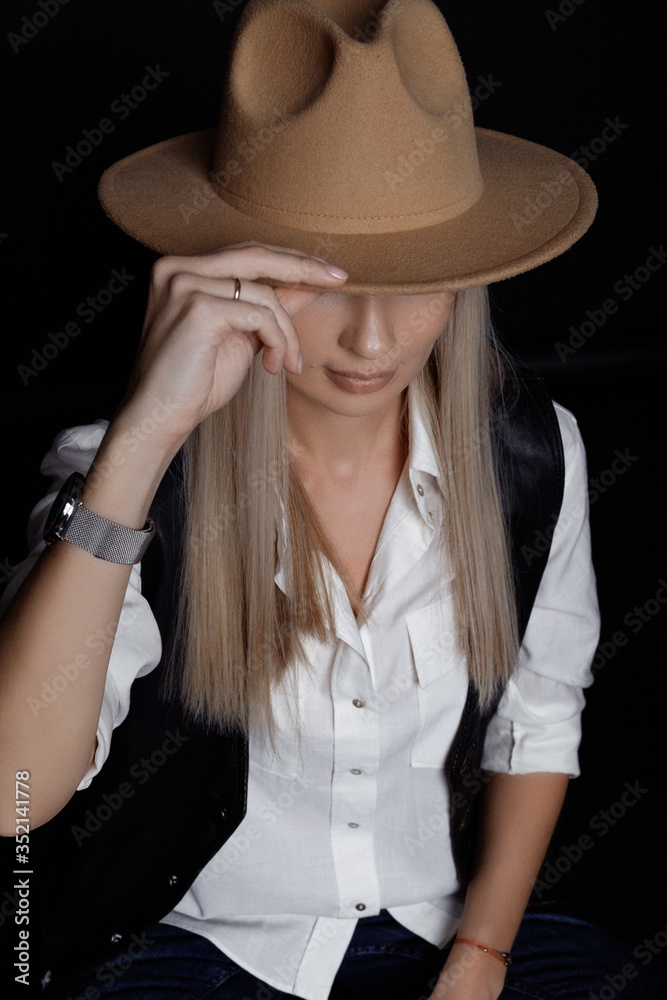Girl covered her face with a hat. Girl covered her face with a hat.