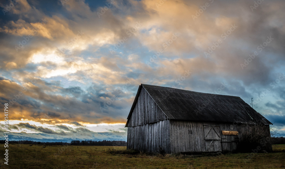 Old wood barn in a middle of a field Old wood barn in a middle of a field