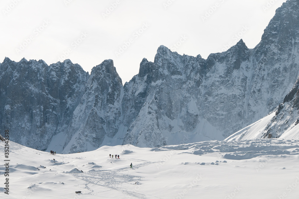 Winter landscape with snow at the Argentiere glacier, in the Mont Blanc massif, near Chamonix, France, European Alps. Alpine environment, with rock walls covered by ice.