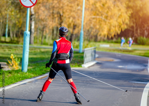 A man rides on roller skates on the track