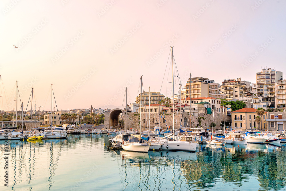 Photo of Heraklion in the early morning during sun rise, close-up picture of to the old part of the town/city with its antient buildings and marina