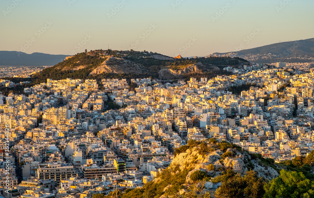 Panoramic sunset view of metropolitan Athens, Greece, with northern residential quarters seen from Lycabettus hill