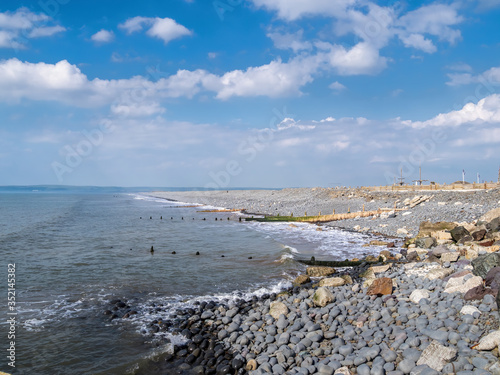 Pebble ridge beach scene at Westward Ho in north Devon, England. No people. photo