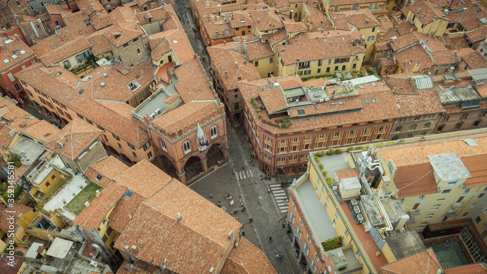 Aerial view of Piazza della Mercanzia with his medieval Palace, from the top of Tower of Asinelli (Torre degli Asinelli), Bologna, Emilia-Romagna, Italy