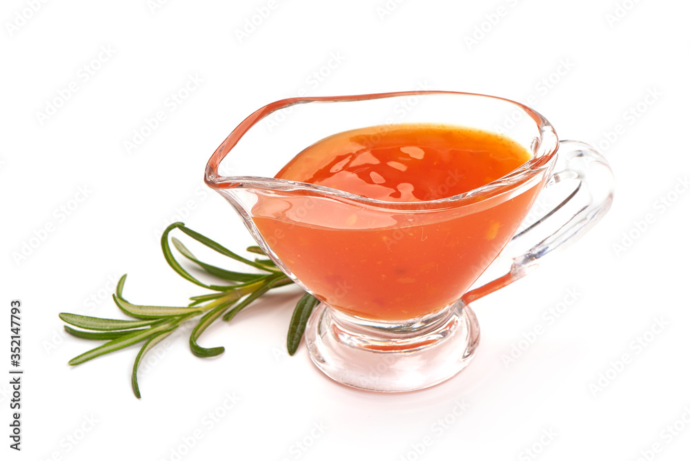 Sweet chili sauce in a gravy boat, isolated on white background Sweet chili sauce in a gravy boat, isolated on white background