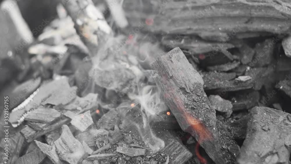Burning charcoal in slow motion, close-up. Burning charcoal in slow motion, close-up.