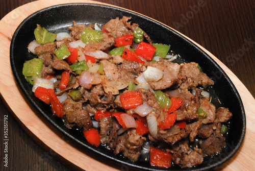 fried beef with green and red bell pepper and onion