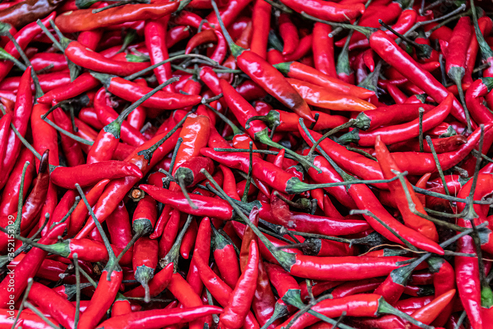 fresh spicy red chilies at a market