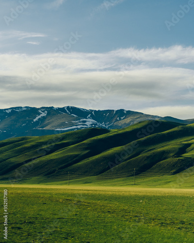 Snowy ridge. Altai mountains. Siberia. beautiful valley with green grass and mountains © Александр Хромов