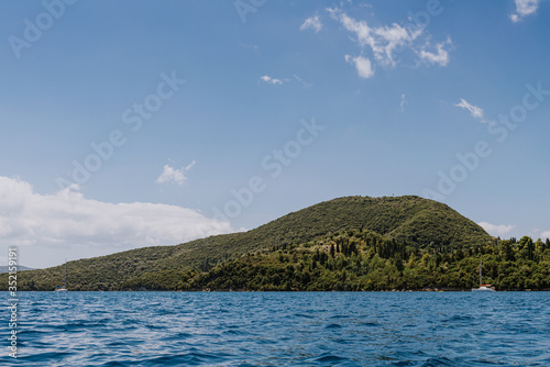 Wallpaper Mural Greek Island viewed from the sea. Beautiful sea landscapes on Island in Greece. In distance is famous Scorpios island, from the left side is Lefkada island and from right is a part of gorgeous Torontodigital.ca