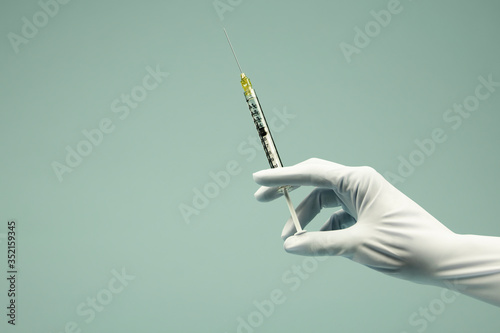 hand with syringe photo