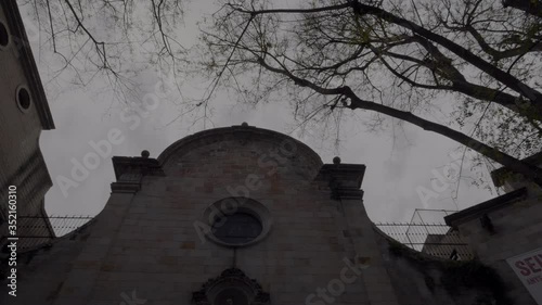 Dark Church Surrounded of Black Trees on a Cloudy Day, Like a Horror Movie, 4K photo