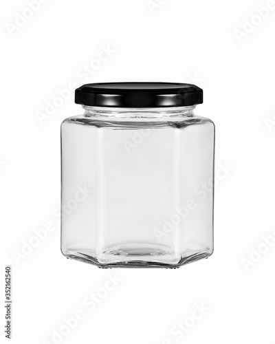 An empty glass jar with a hexagonal shape