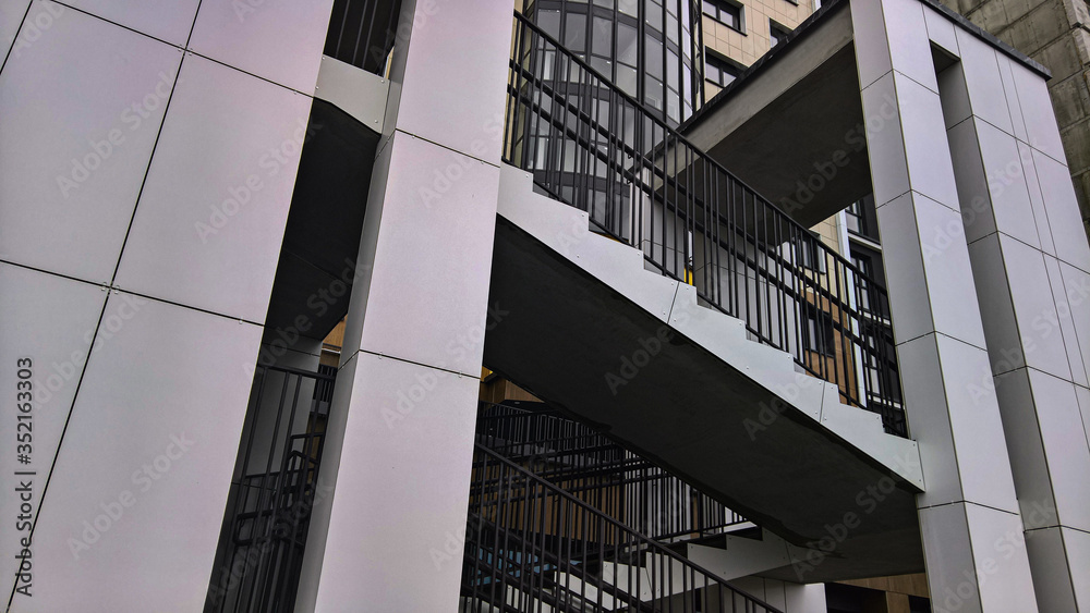 outdoor staircase with railing near the building outdoor staircase with railing near the building