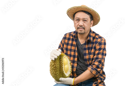 king of fruit in Thailand , Asian man farmer holding Mon Thong Durian isolated