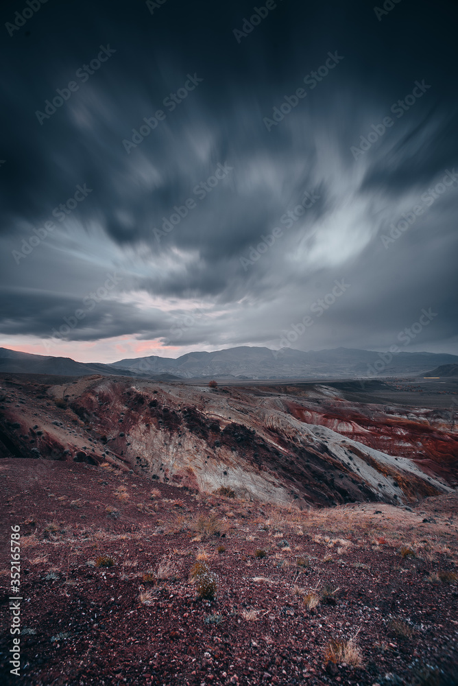 red mountains and snow-capped peaks in Altai