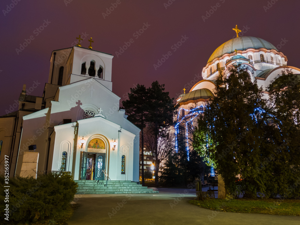 Small church of Saint Sava next to the Saint Sava Temple (Hram Svetog Save) on Vracar plateau in Belgrade, Serbia, at night.