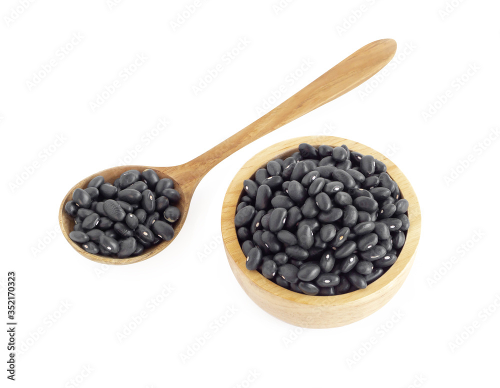 Closeup black beans seeds in wooden bowl on white background, healthy food concept Closeup black beans seeds in wooden bowl on white background, healthy food concept
