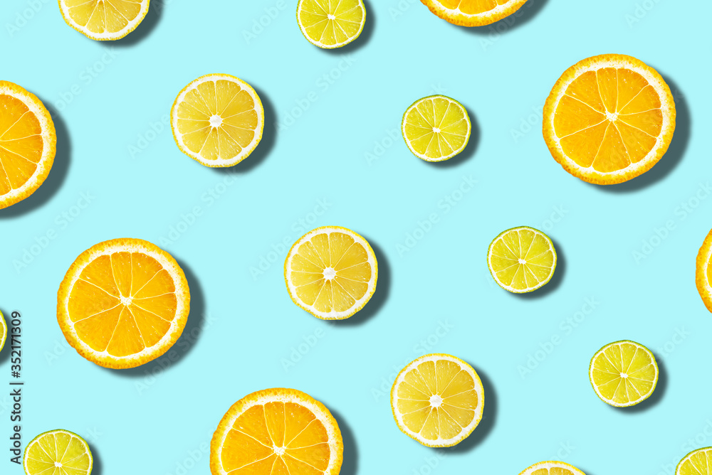 citrus on blue background, oranges, limes slices