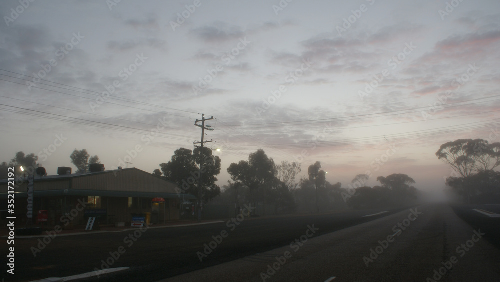 Fototapeta premium Foggy Town Sunset Clouds Pink Grey Sky