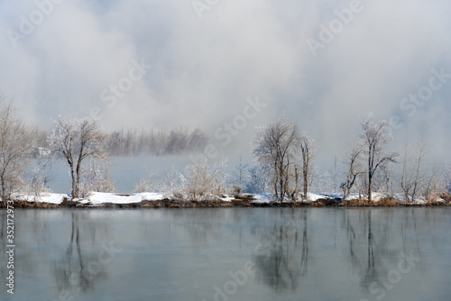 Frozen nature in Yakutia. Yakutia is one of the most coldest place on earth. Snow and frozen branches, trees and lakes during whole winter time. misty morning on the river