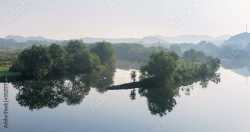 time lapse of the peaceful moon bay in morning, idyllic scenery in wuyuan county, jiangxi province, China photo