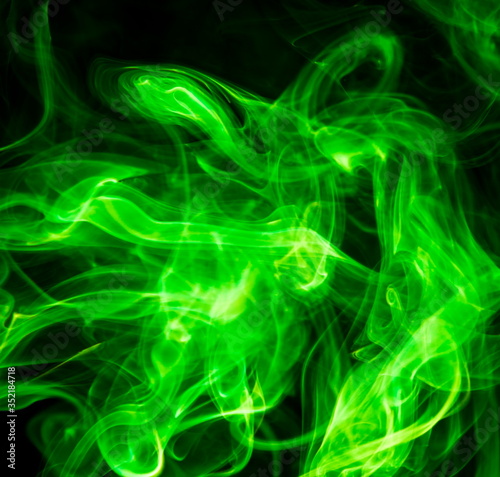 Green smoke on black background