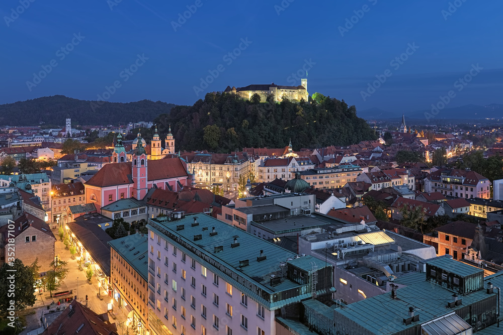 Ljubljana, Slovenia. High angle view on the historical part of the city in dusk. View from observation desk at the top floor of the Neboticnik building (The Skyscraper).