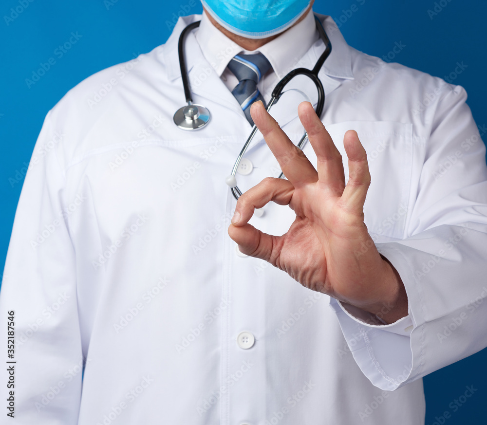 doctor in white coat shows ok gesture with his hand doctor in white coat shows ok gesture with his hand