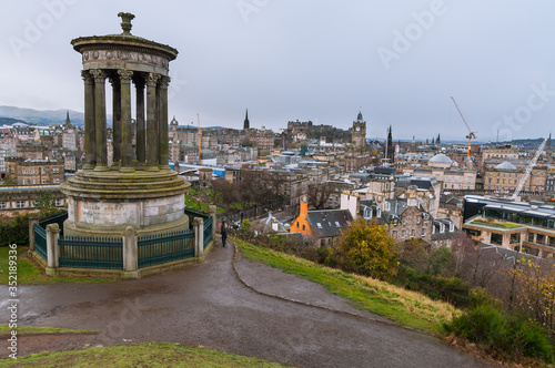 View from Calton Hill on the panorama of Edinburgh (Scotland) with Dugald Steward monument photo