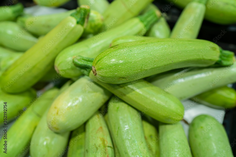 fresh zucchini standing at the market counter
fresh zucchini standing at the market counter