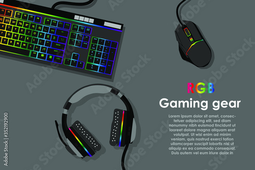 gamer workspace concept, top view a gaming gear, mouse, keyboard, joystick, headset, mobile joystick, in ear headphone and mouse pad on black table background with copy space.
