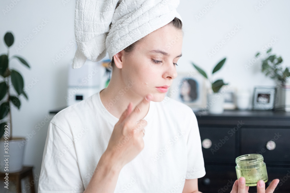 woman with towel around head after shower. morning routine concept. home spa. stay home. self care woman with towel around head after shower. morning routine concept. home spa. stay home. self care