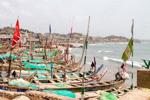 Fishing boats in front of Cape Coast Castle, Ghana photo