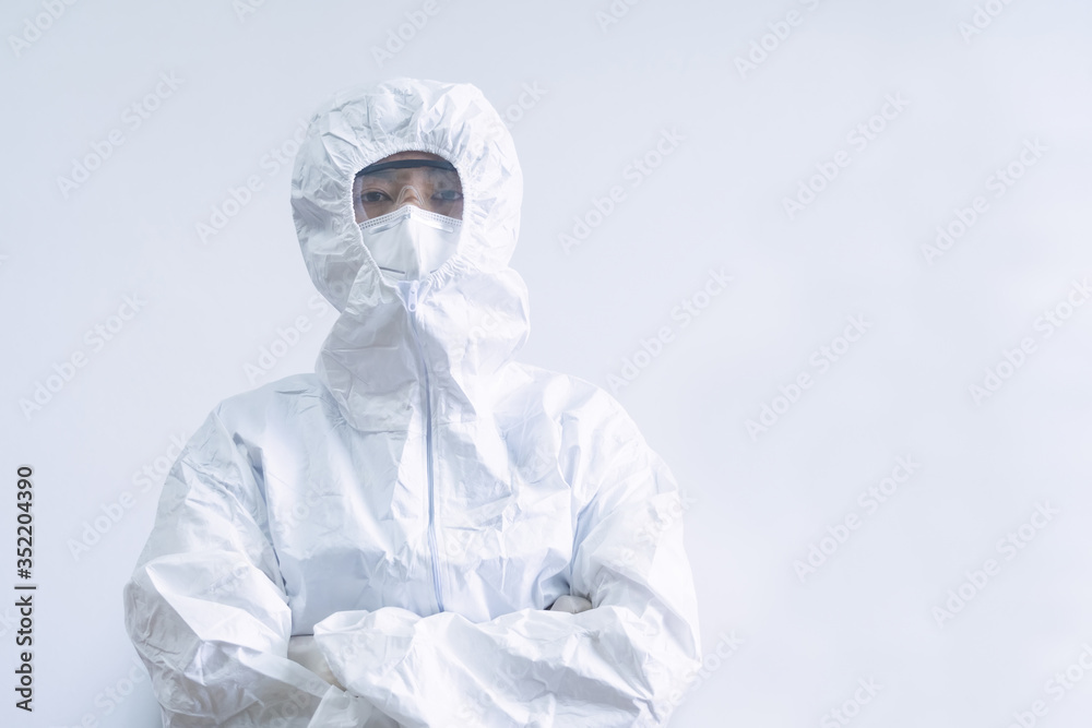 Medical staff in PPE suit holding syringes and vaccines for the treatment of the COVID-19 virus. Medical researchers in the lab are testing vaccines for the treatment of viral diseases.