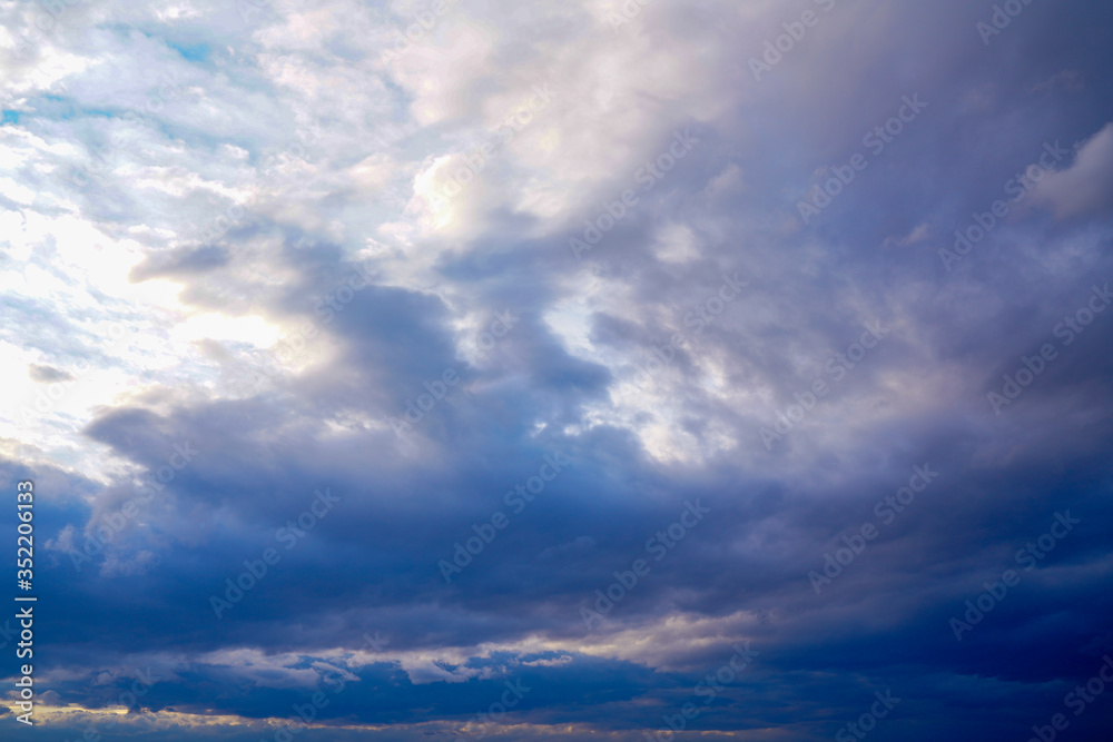clouds at sunset. dramatic sky skyline background 