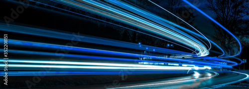 Fotografija blue car lights at night. long exposure