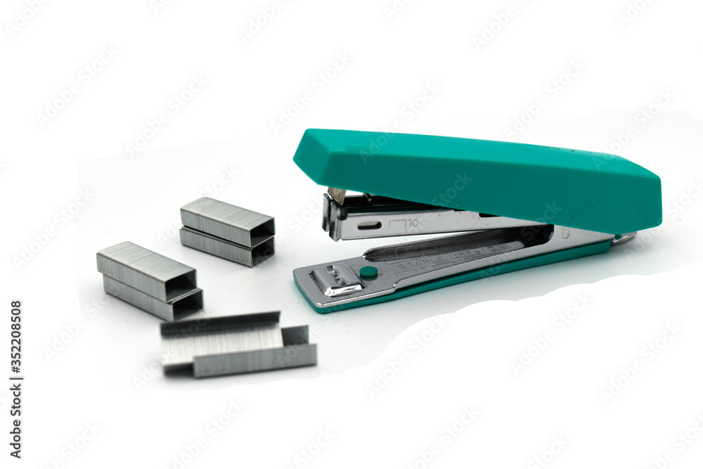 Green Max stapler with staple paper.A stapler is a mechanical device that joins pages of paper or similar material by driving a thin metal staple through the sheets and folding the ends. Green Max stapler with staple paper.A stapler is a mechanical device that joins pages of paper or similar material by driving a thin metal staple through the sheets and folding the ends.