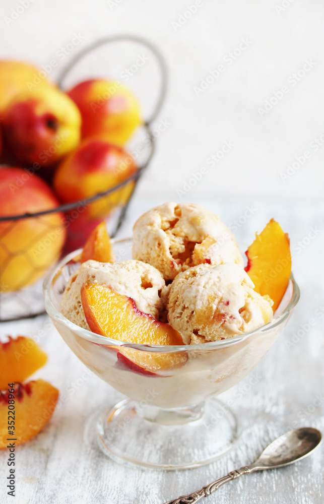 homemade creamy ice cream with peach in a glass bowl homemade creamy ice cream with peach in a glass bowl