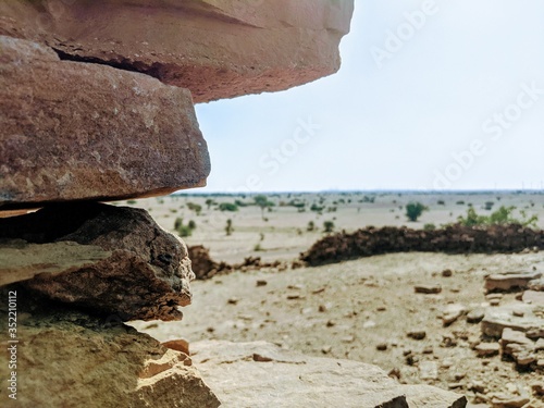 Stone wall ruins over desert